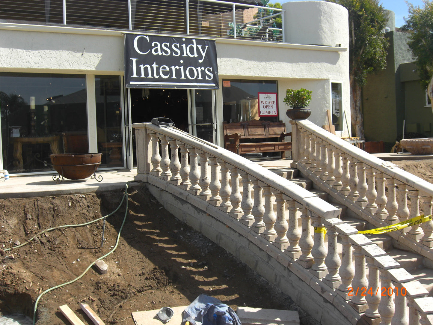 Midway through construction of our cantera stone storefront railing